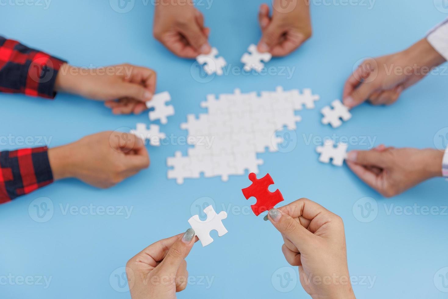 Hands of diverse people assembling jigsaw puzzle, team put pieces together  searching for right match, help support in teamwork to find common solution  concept, top close up view 8316659 Stock Photo at