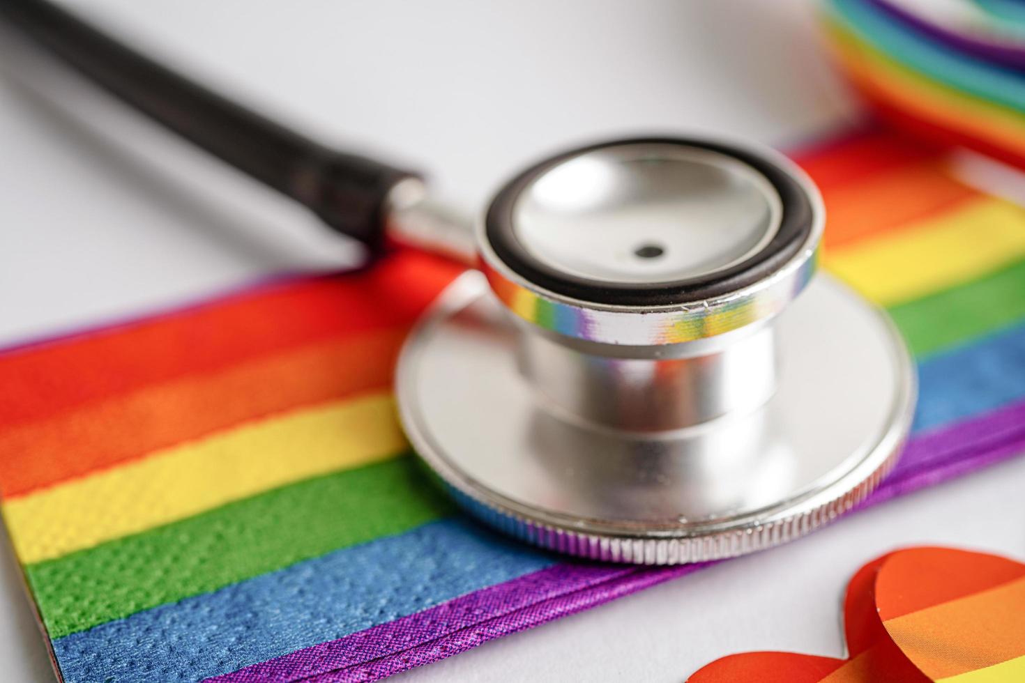 Black stethoscope on rainbow flag background, symbol of LGBT pride month celebrate annual in June social photo
