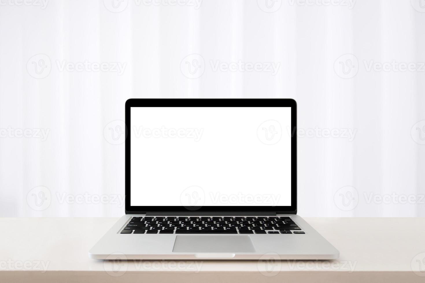 laptop computer on table with abstract blur white hospital curtain background photo