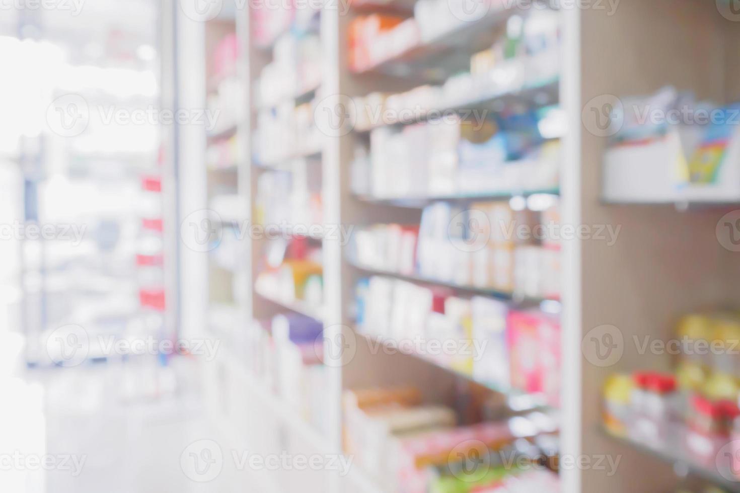 pharmacy store interior with medicine on medical shelves blur background photo