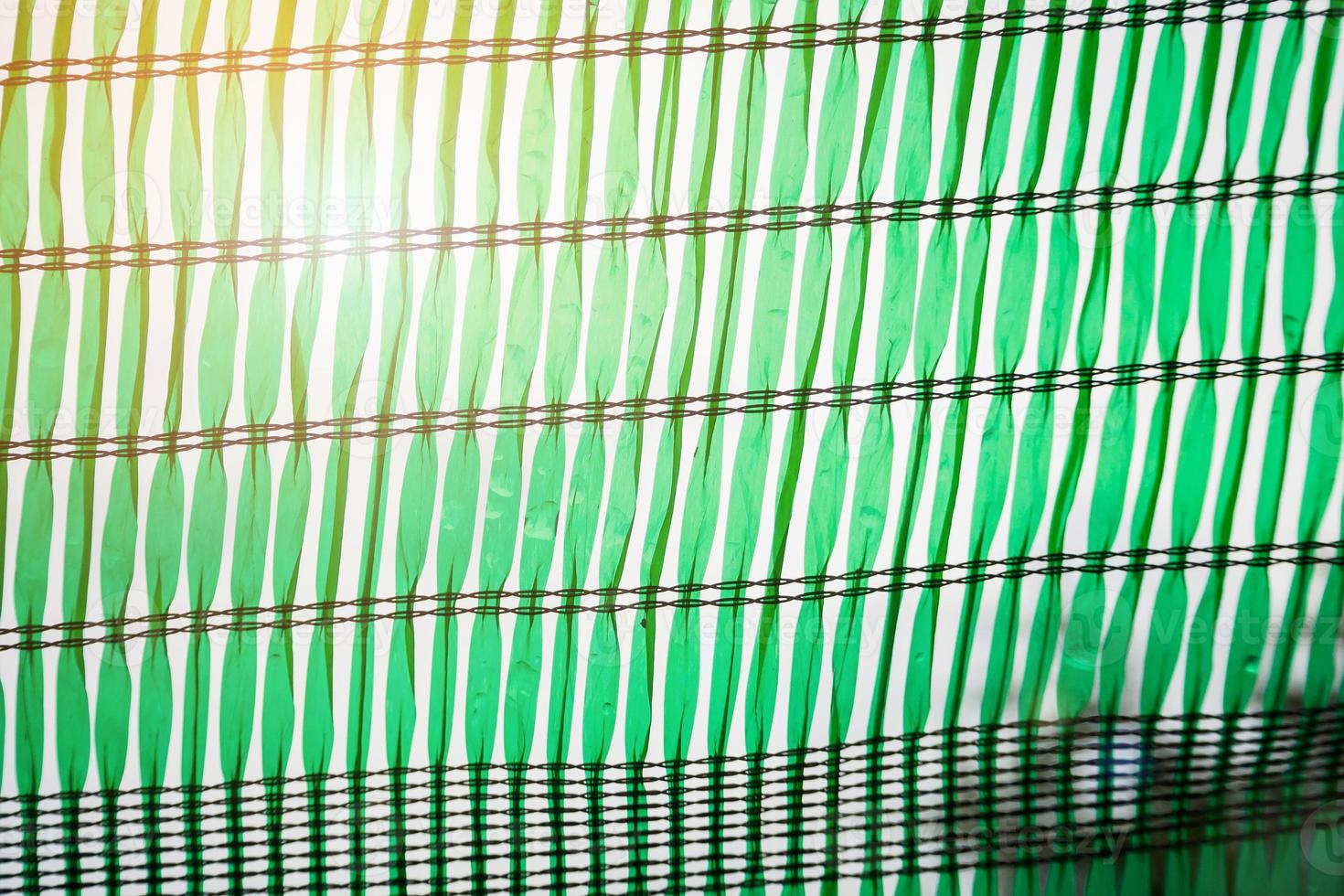 Green Shading Net for protect sun light with tree leaves shadow photo