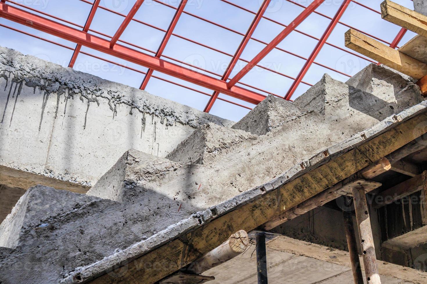 New house construction with concrete staircase at building site photo