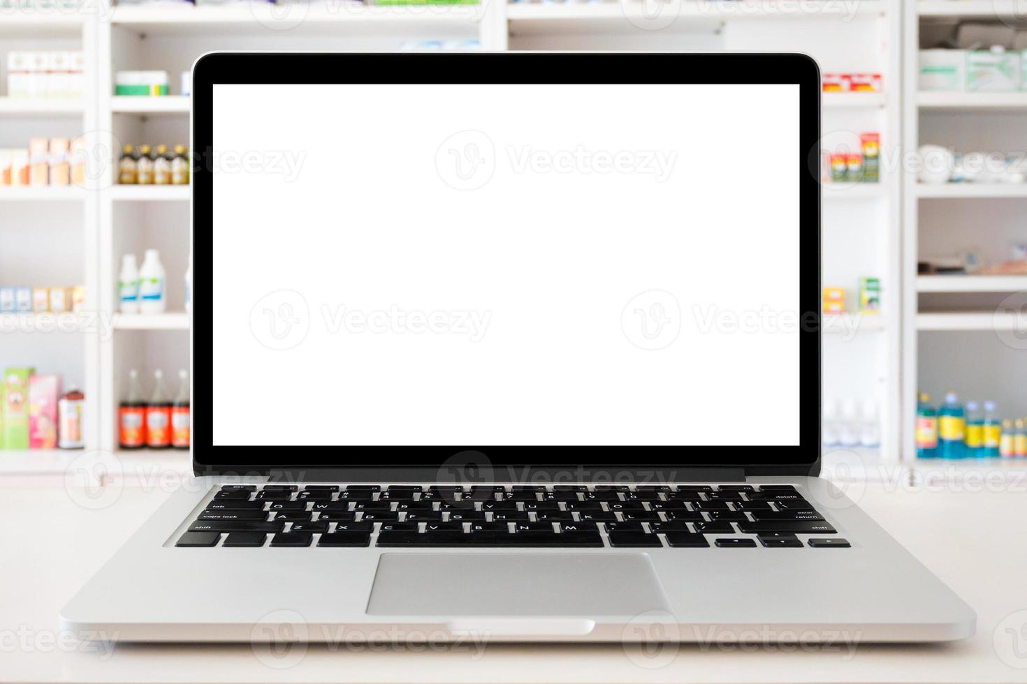 pharmacy store with laptop computer on medical counter photo