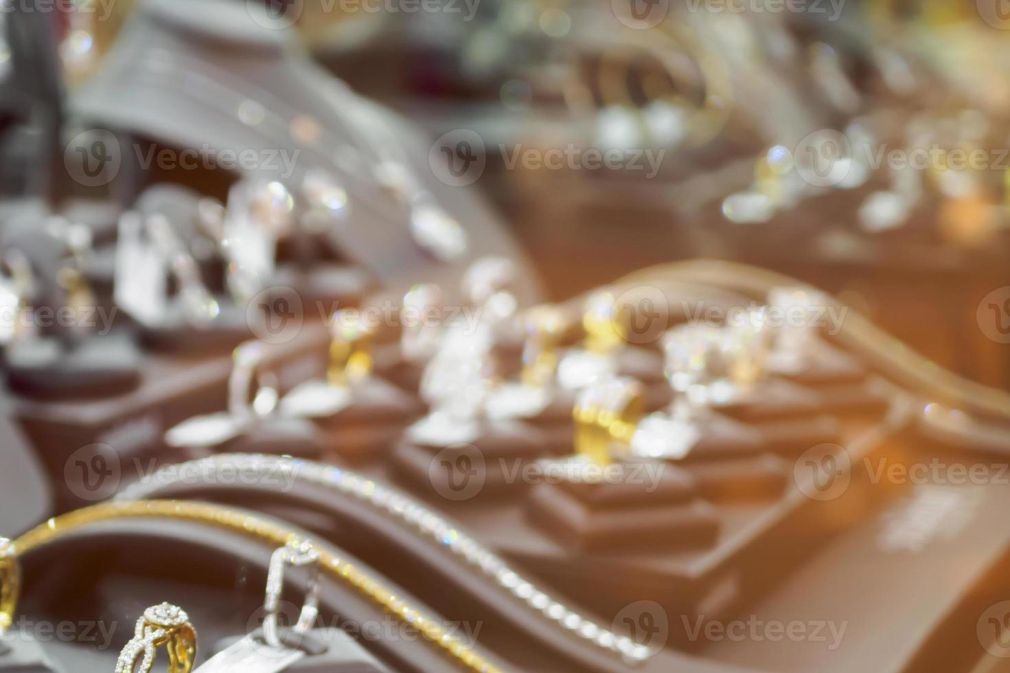 Abstract blur jewelry diamond shop with rings and necklaces luxury retail store window display photo