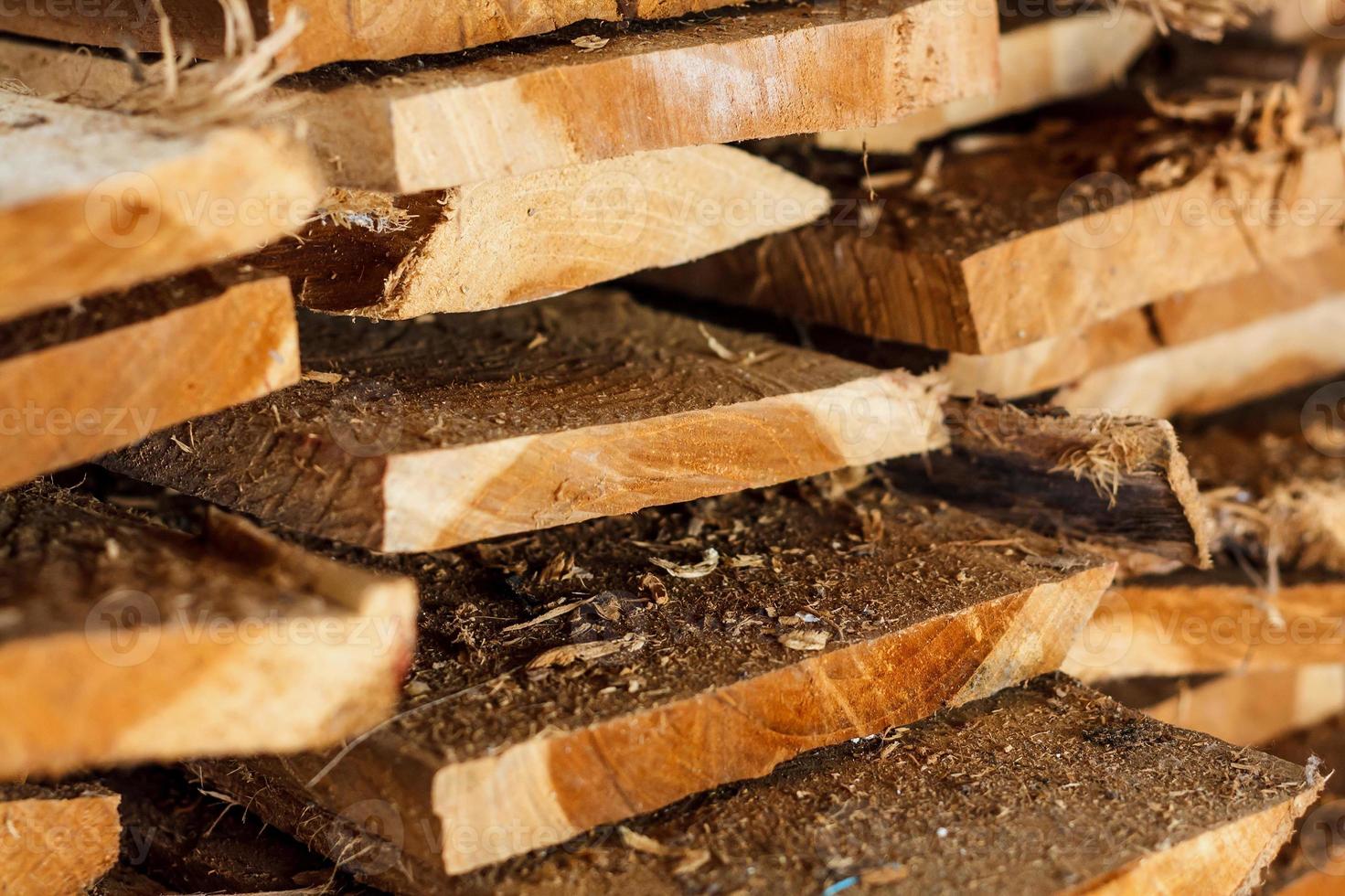 Large stack of wood planks photo