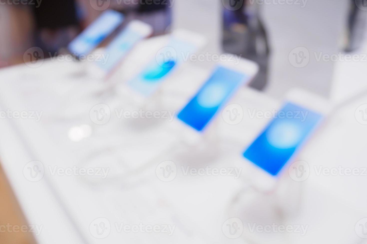 abstract mobile smartphone in store blurred background photo