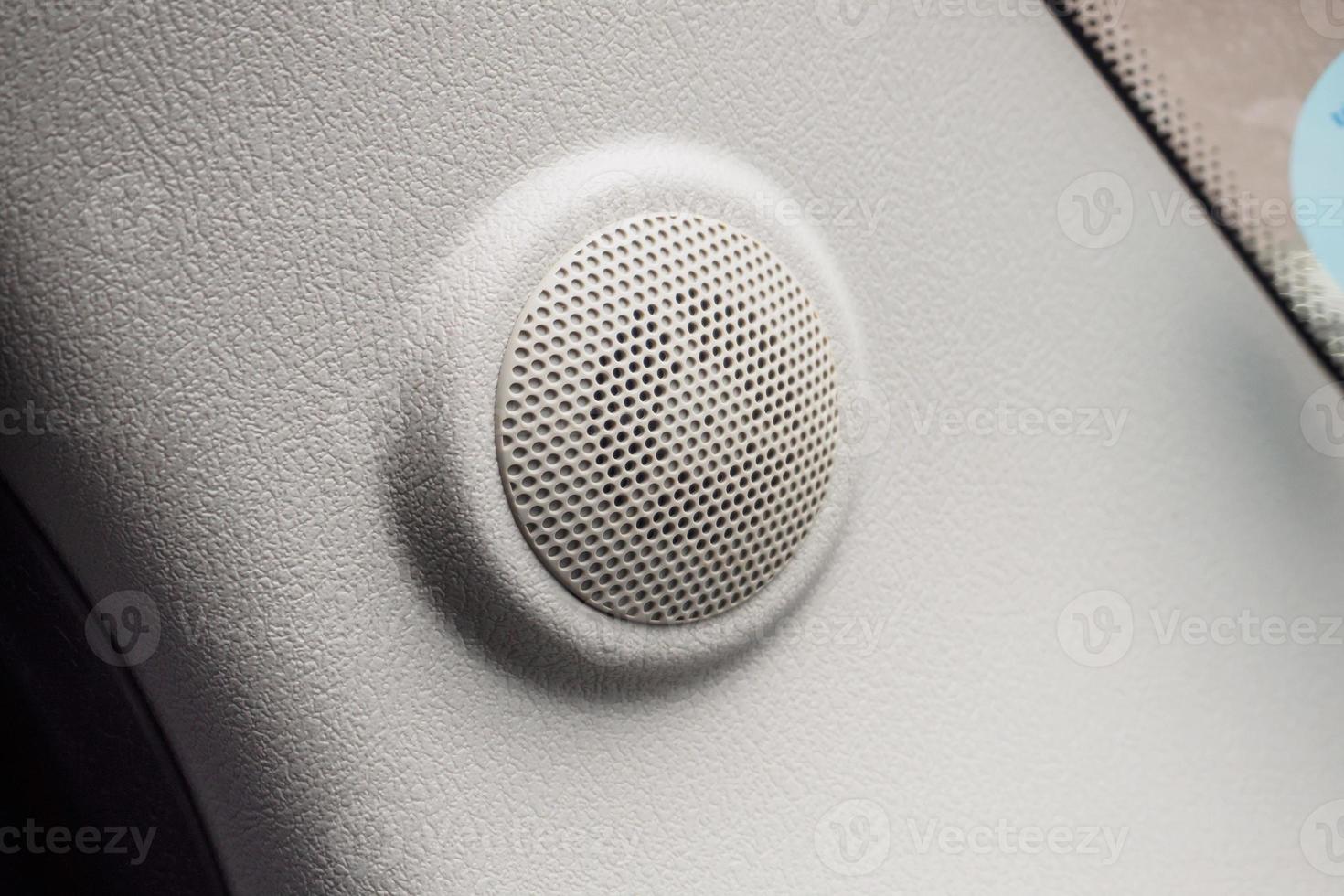 close up round speaker in modern car photo