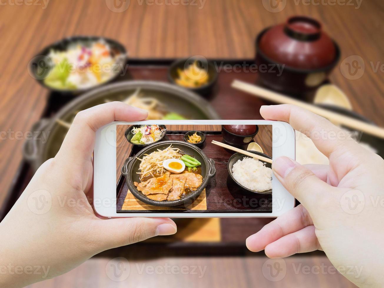 pork with egg and vegetables on hot plate photo