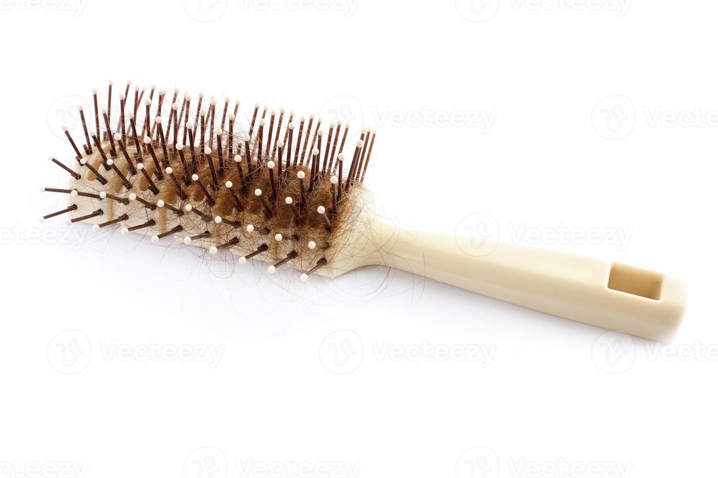 Hair brush with lost hair on white background photo