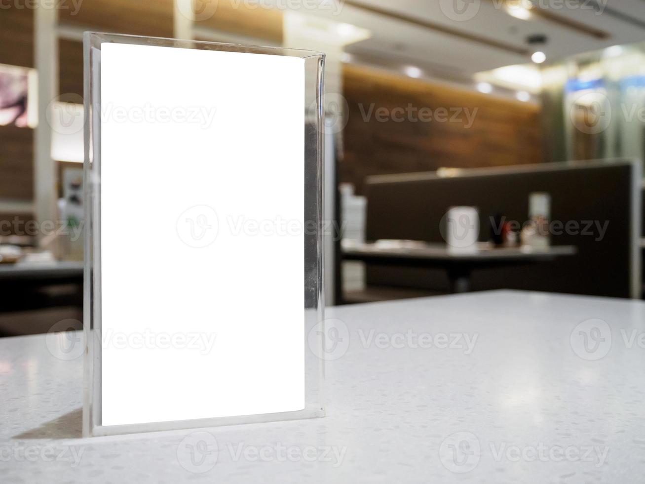 Mock up menu frame on table in the cafe restaurant photo