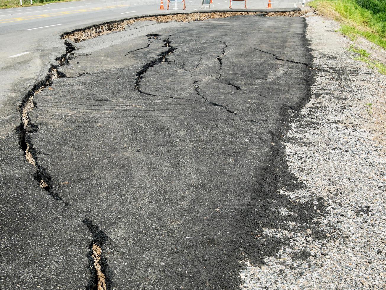 asphalt road cracked and broken texture photo