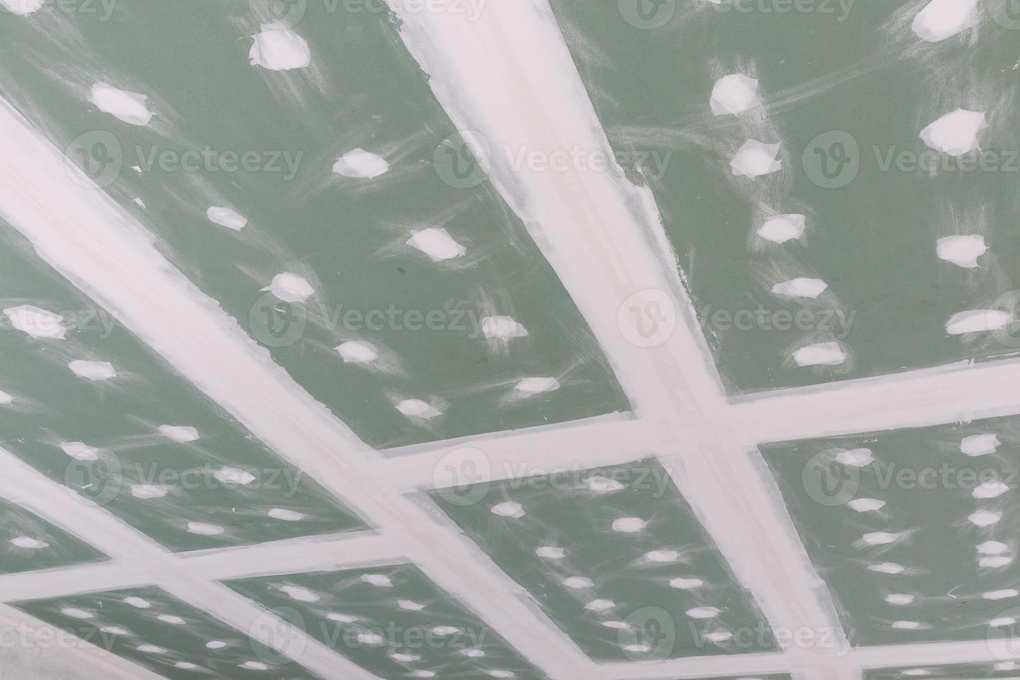 ceiling gypsum board installation at construction site photo