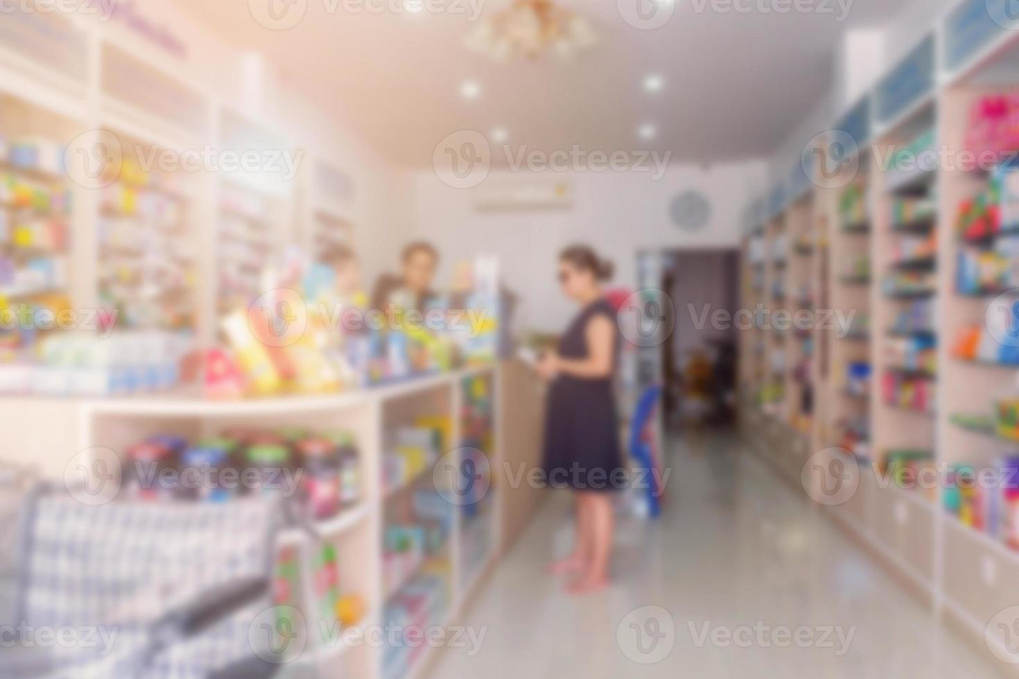 customer in pharmacy drugstore blurred background photo