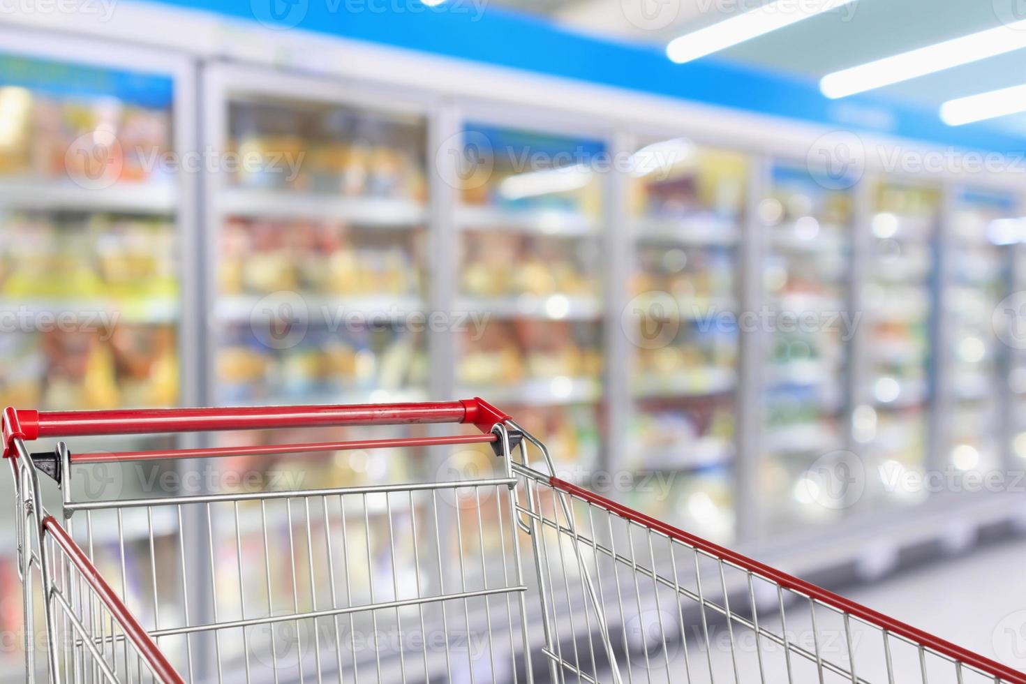 Supermarket refrigerators freezer aisle blur defocused background with