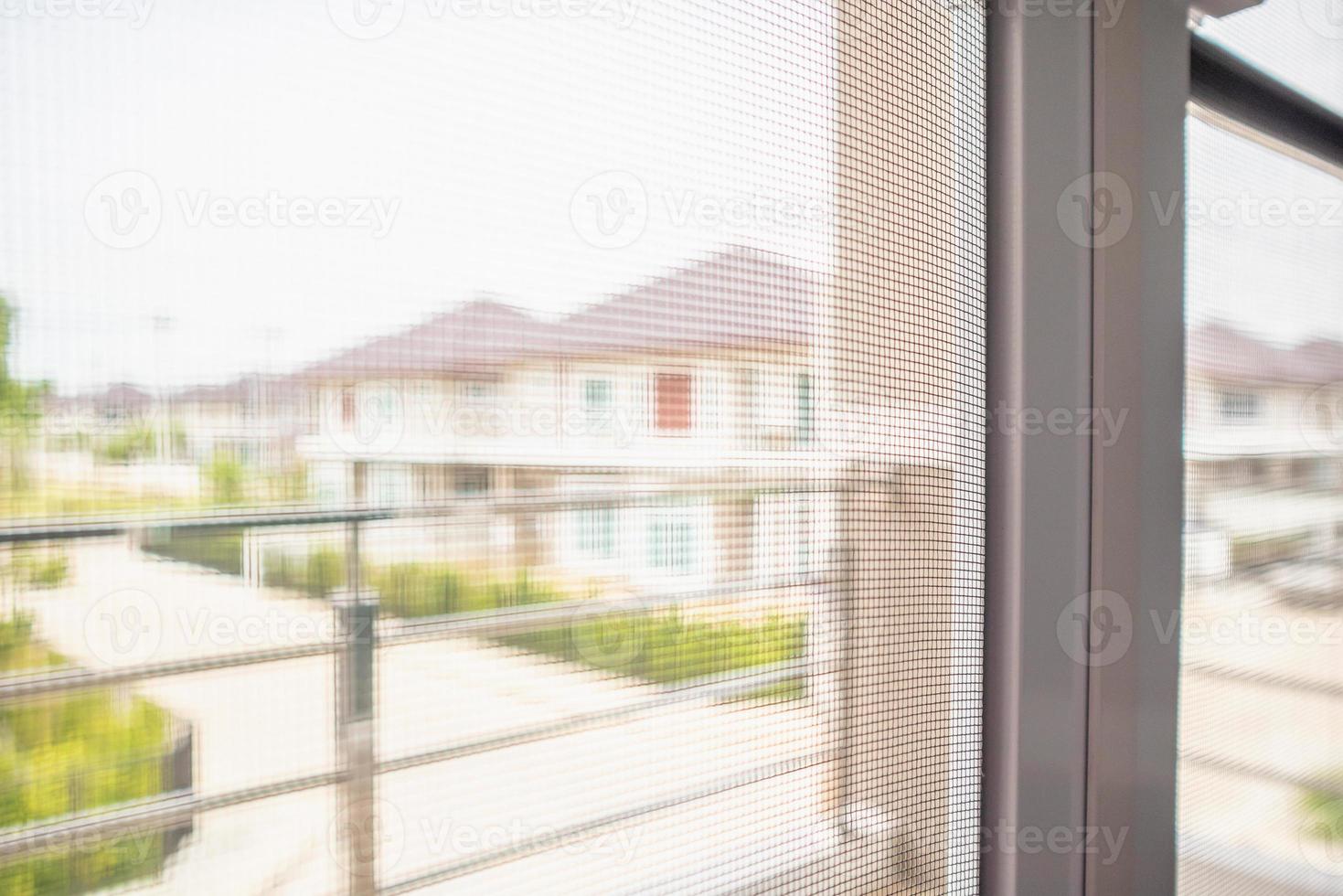 mosquito net wire screen on house window protection against insect photo