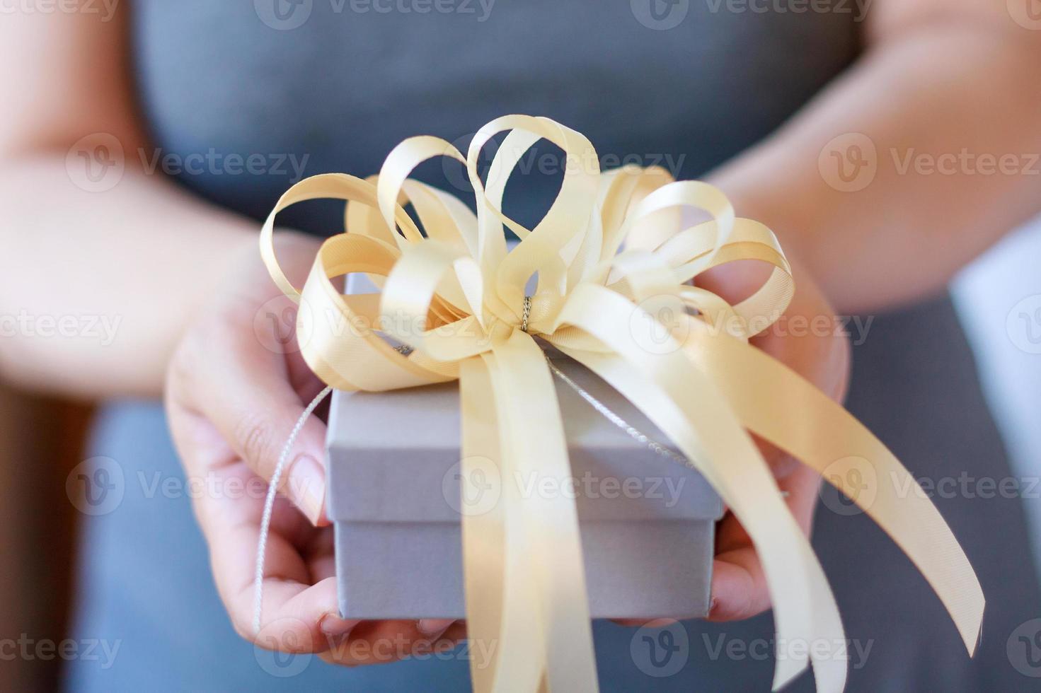 Woman holding gift box photo