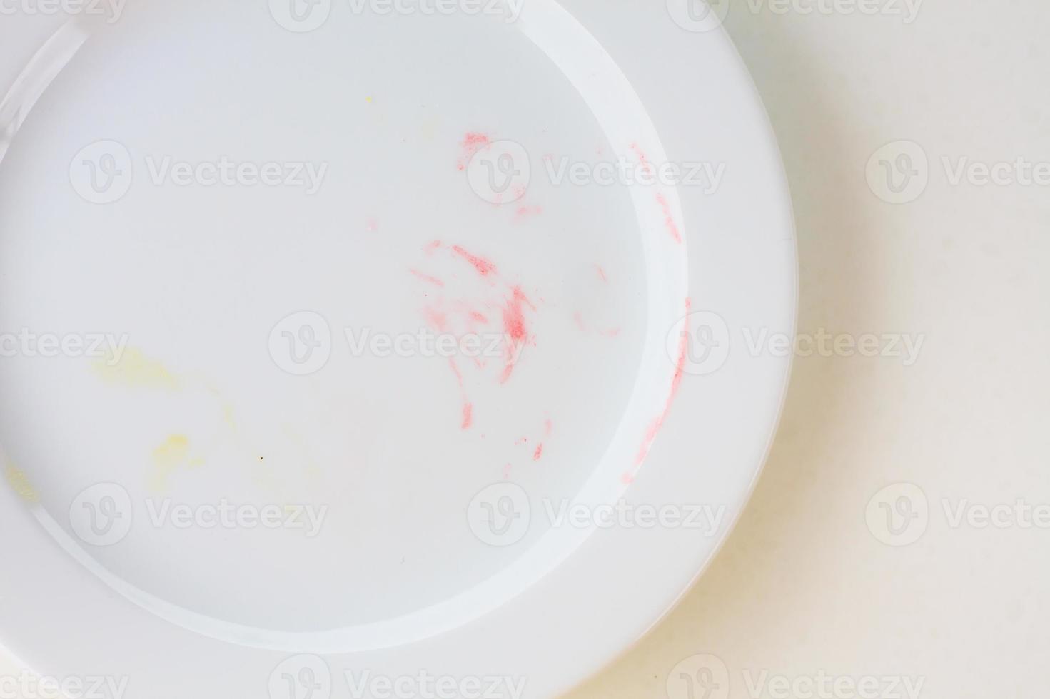 empty plate on white table after blackberry pie photo