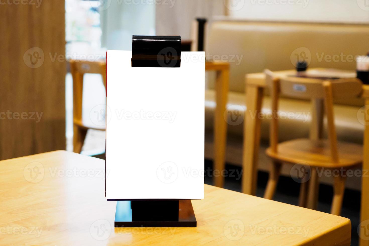 Mock up Blank white menu frame on cafe restaurant table photo
