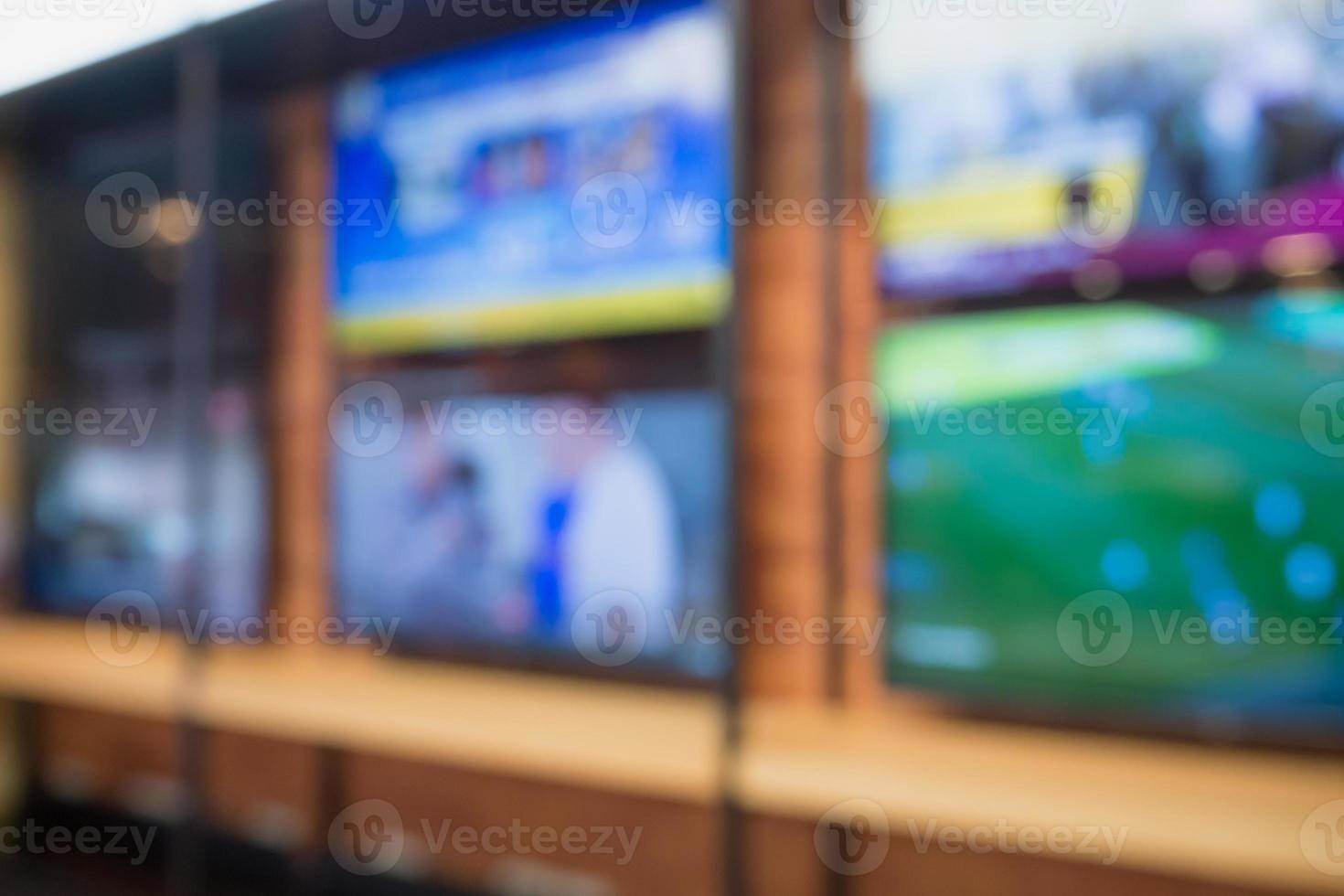 Television shelf in eletronic department store blur abstract background photo