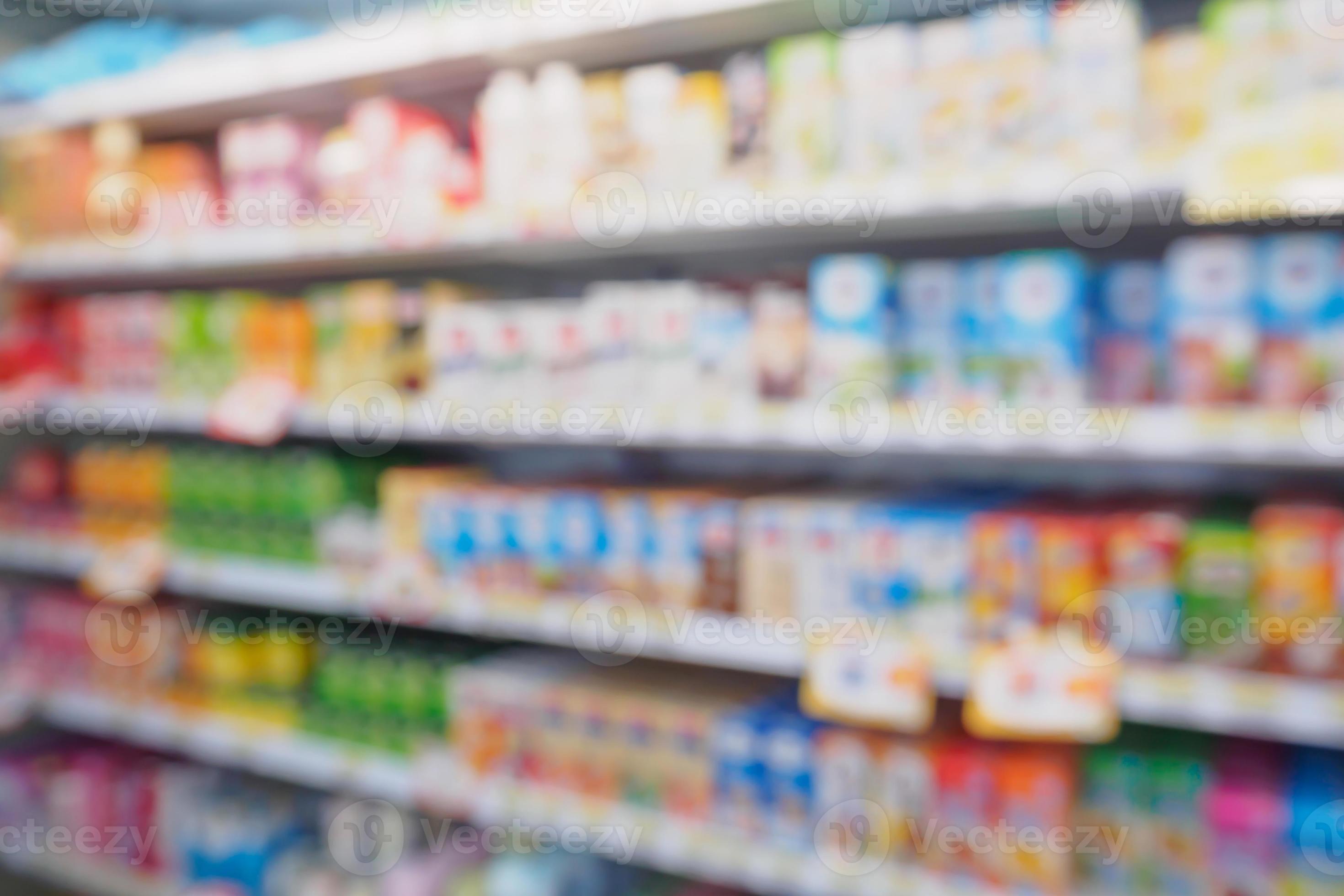 blur refrigerator of food and dairy products shelves in supermarket