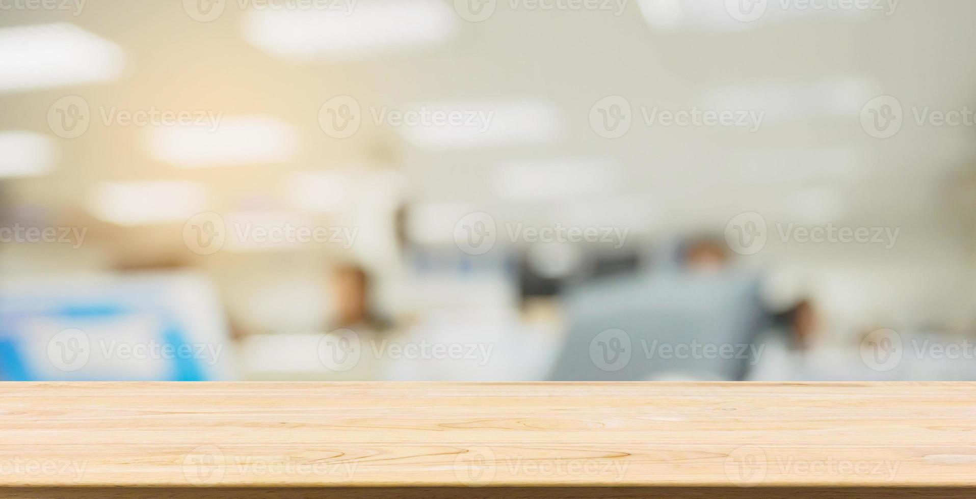 wood table desk with abstract blur office interior business background photo