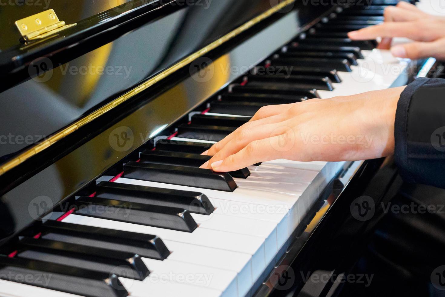 Close up musician hand playing piano photo