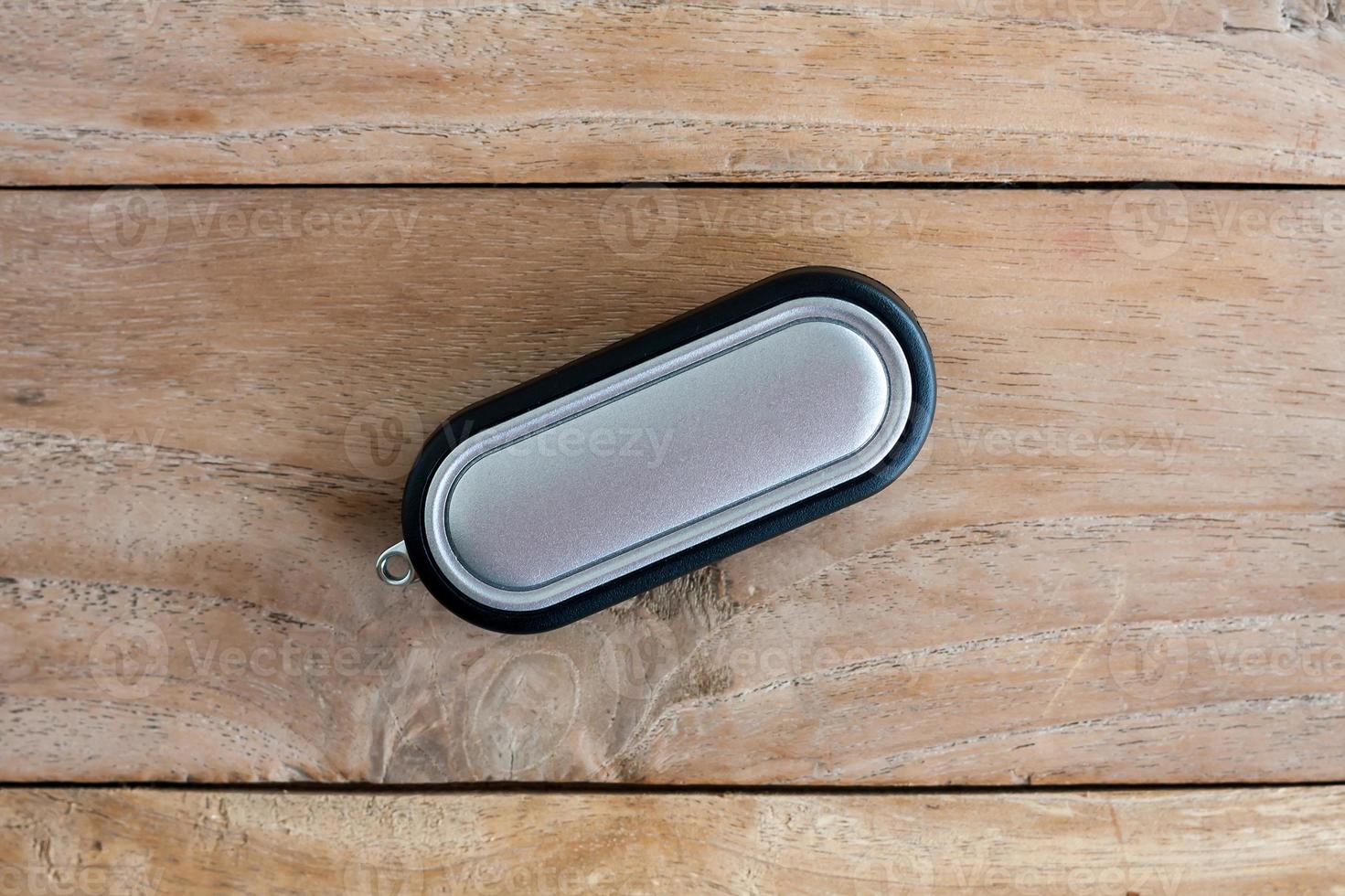 Car Key on old wood table background photo