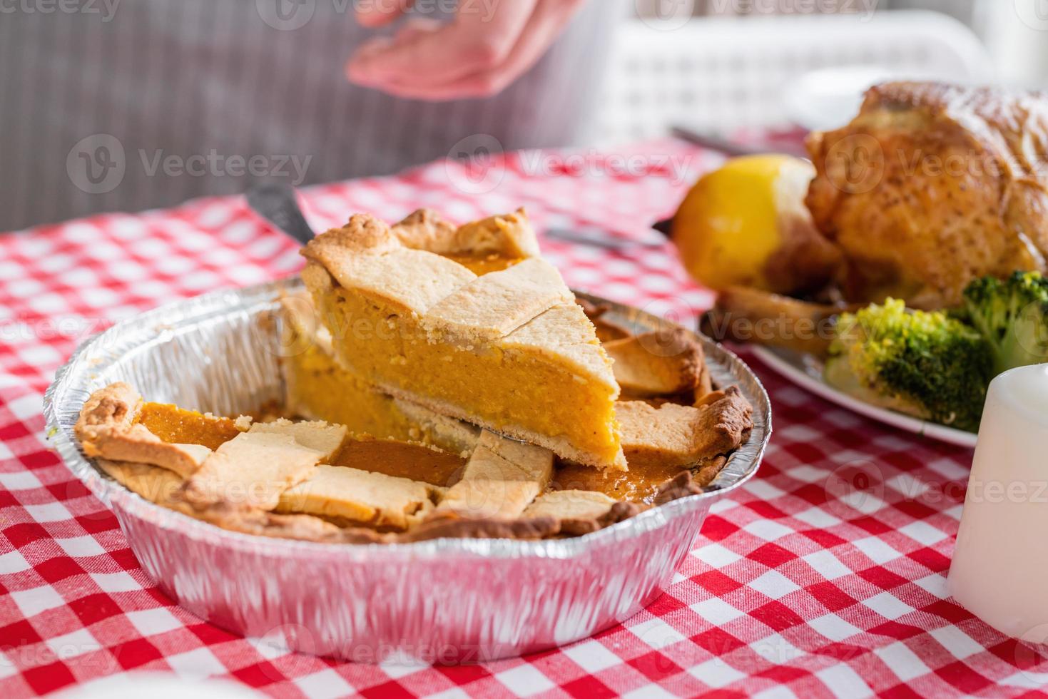 woman preparing thanksgiving dinner at home kitchen, decorating photo