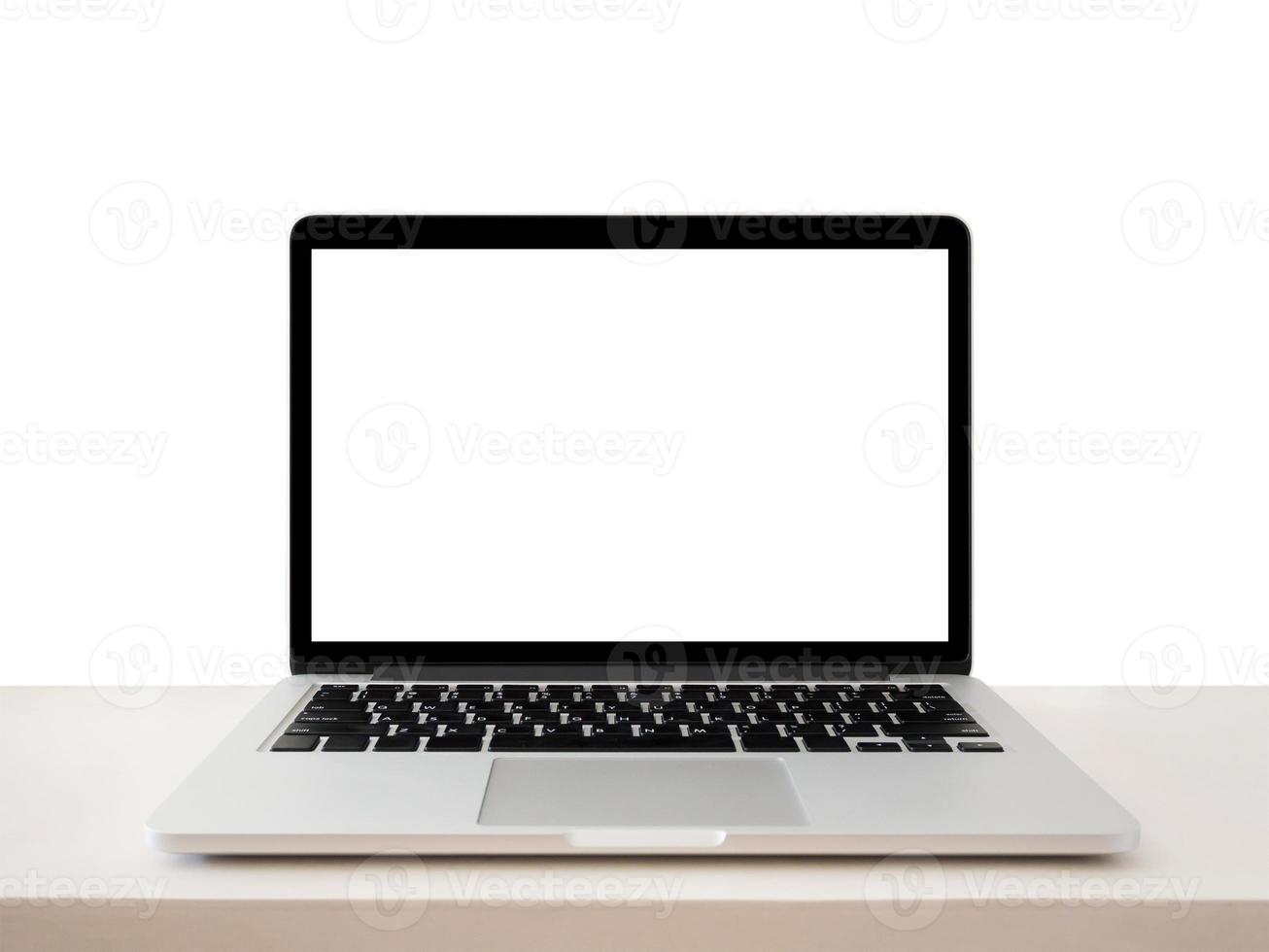 Laptop with blank screen on table photo