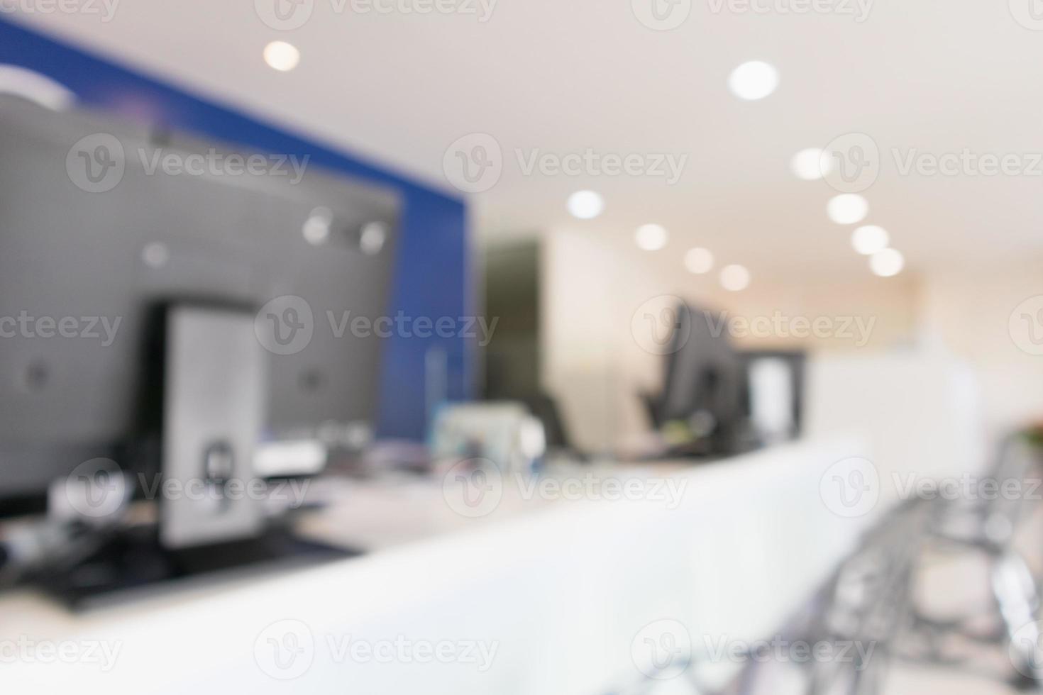 Abstract blur office desk workplace or hospital with computer defocused background photo