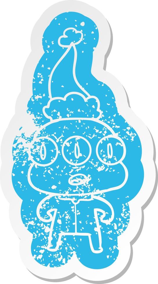 cartoon distressed sticker of a three eyed alien wearing santa hat vector