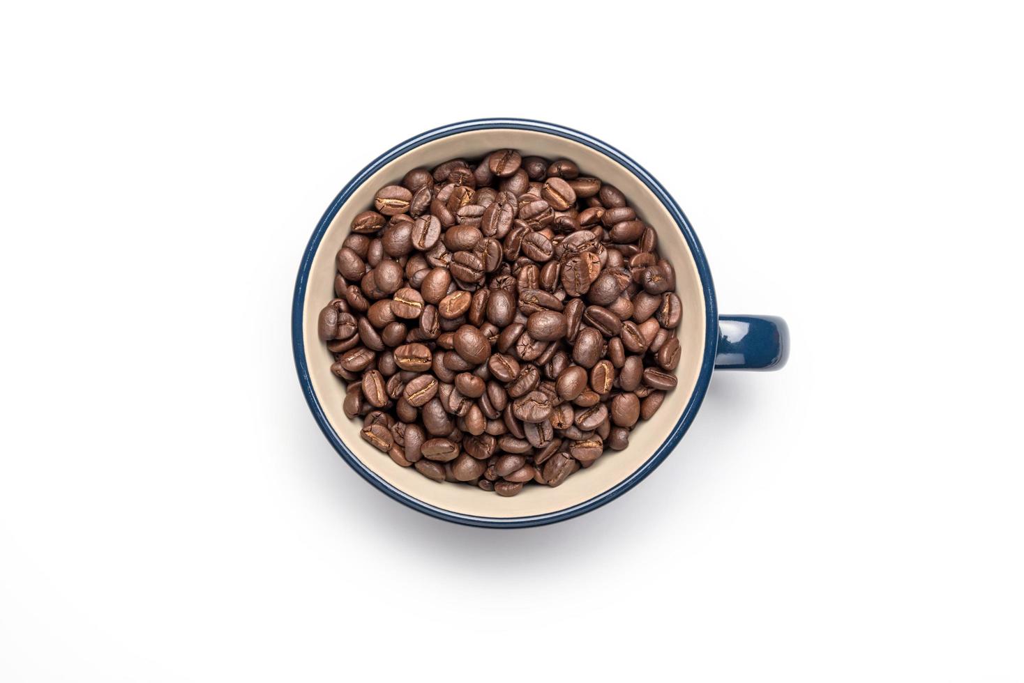 Cup and coffee beans, isolated on a white background. Full frame photo