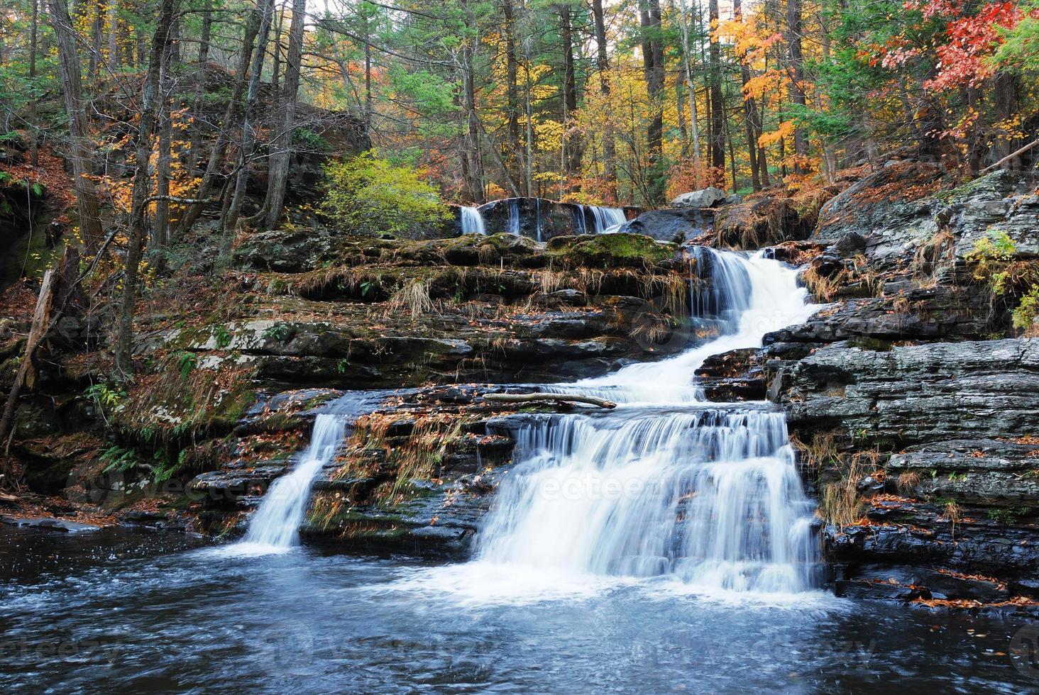 Autumn Waterfall in mountain photo