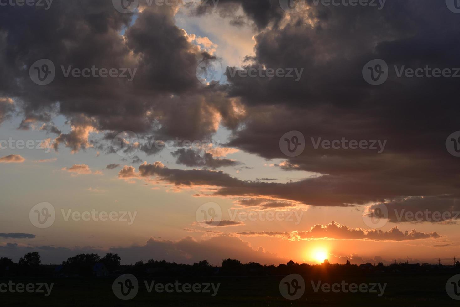 Beautiful golden evening sunset with pink clouds photo