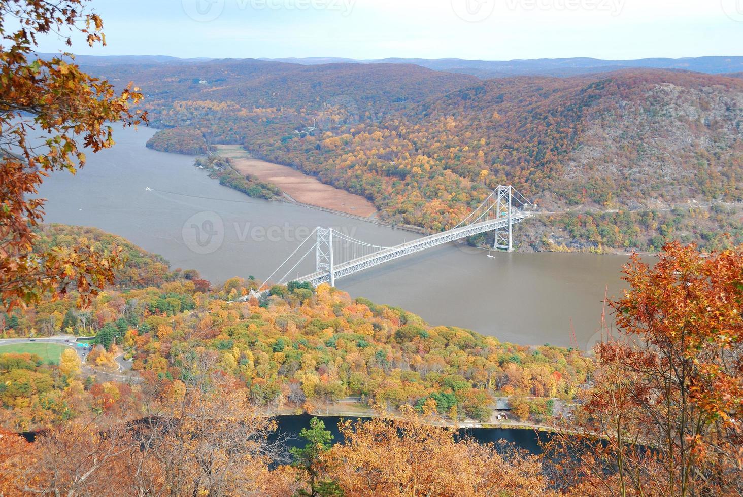Autumn bridge with colorful trees photo