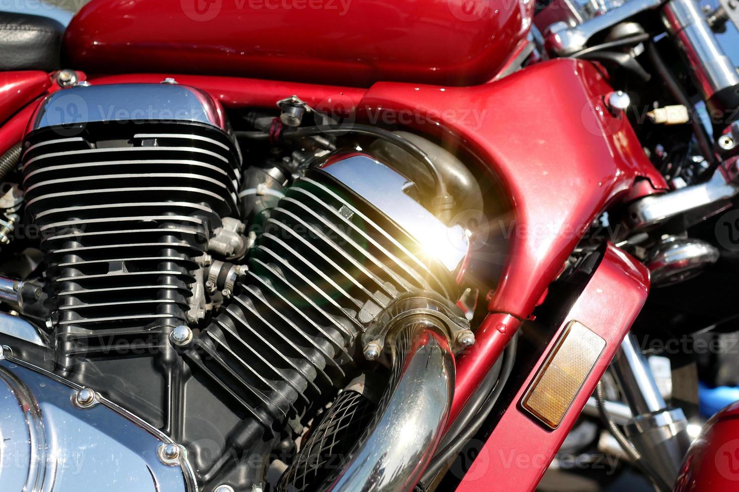 Motorcycle engine close-up background. The bike glistens in the sun. photo