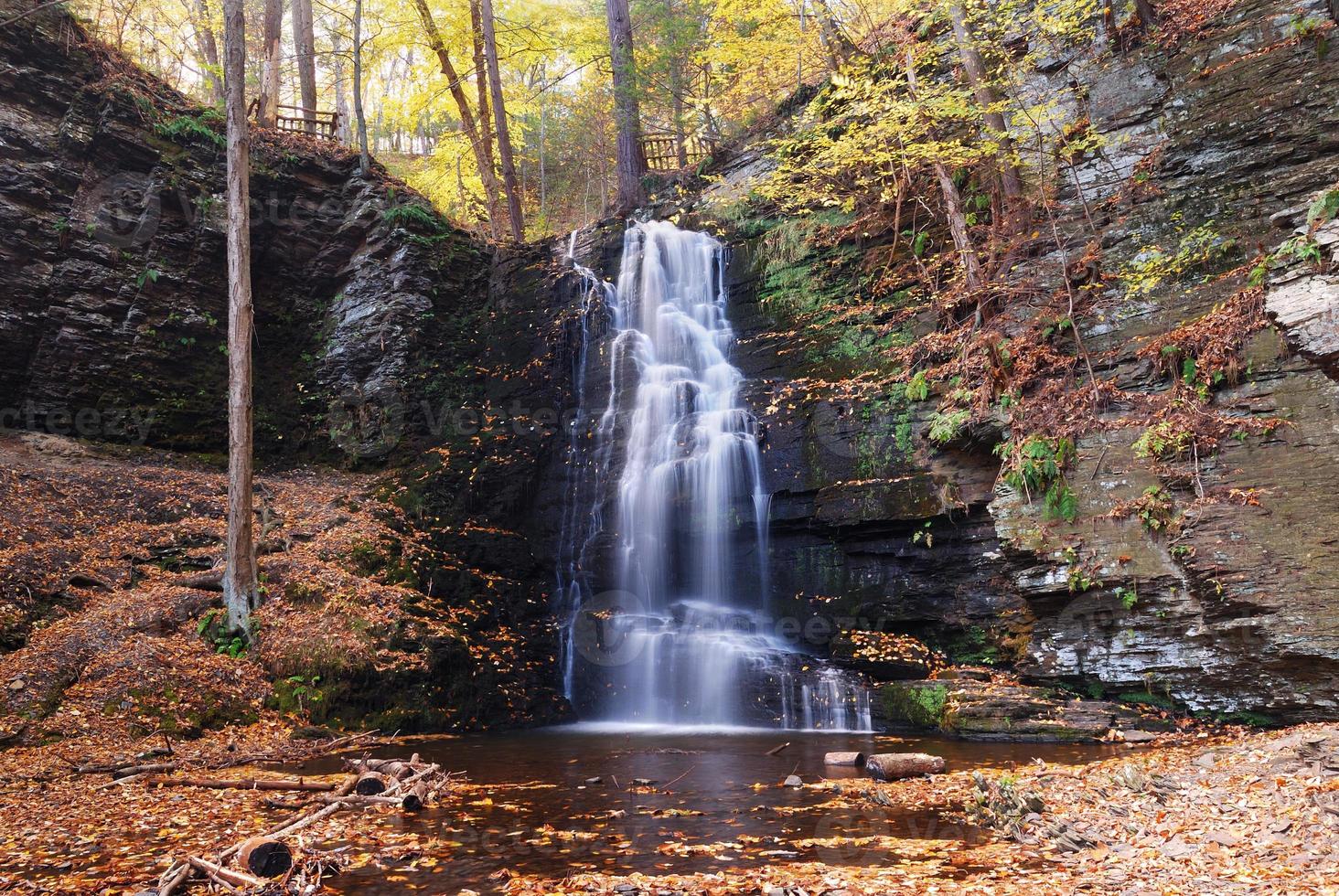 Autumn Waterfall in mountain. photo