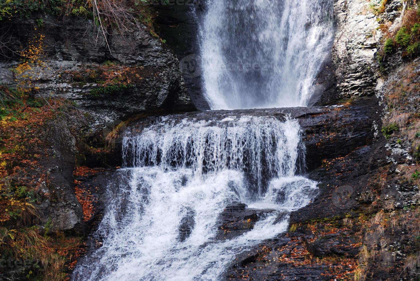 Autumn Waterfall in mountain photo