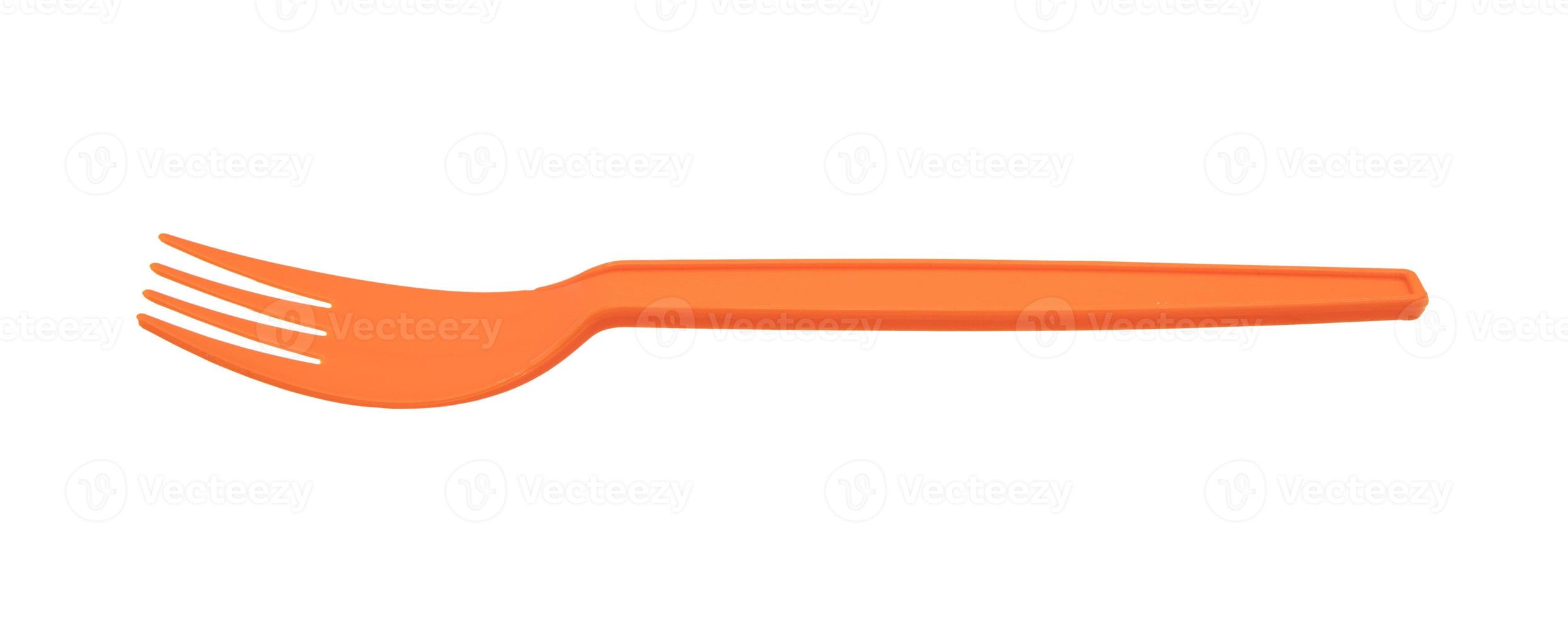 Orange plastic fork isolated on white background photo