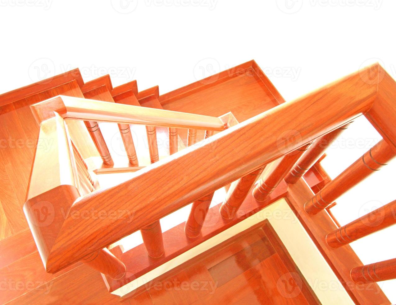 Wooden stairs and handrail isolated on white background photo