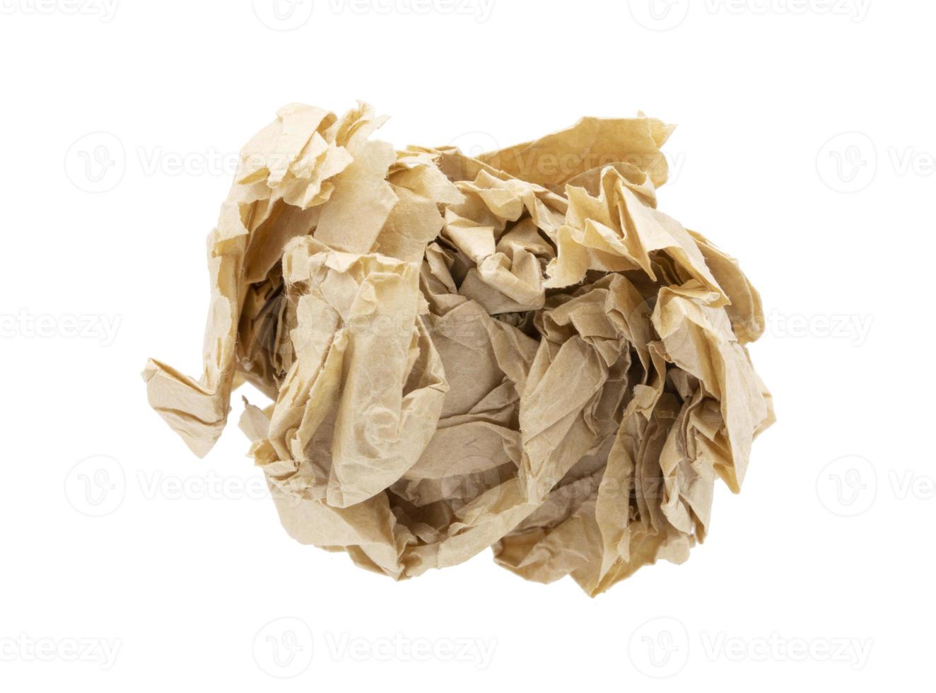 Crumbled paper ball isolated over the white background photo