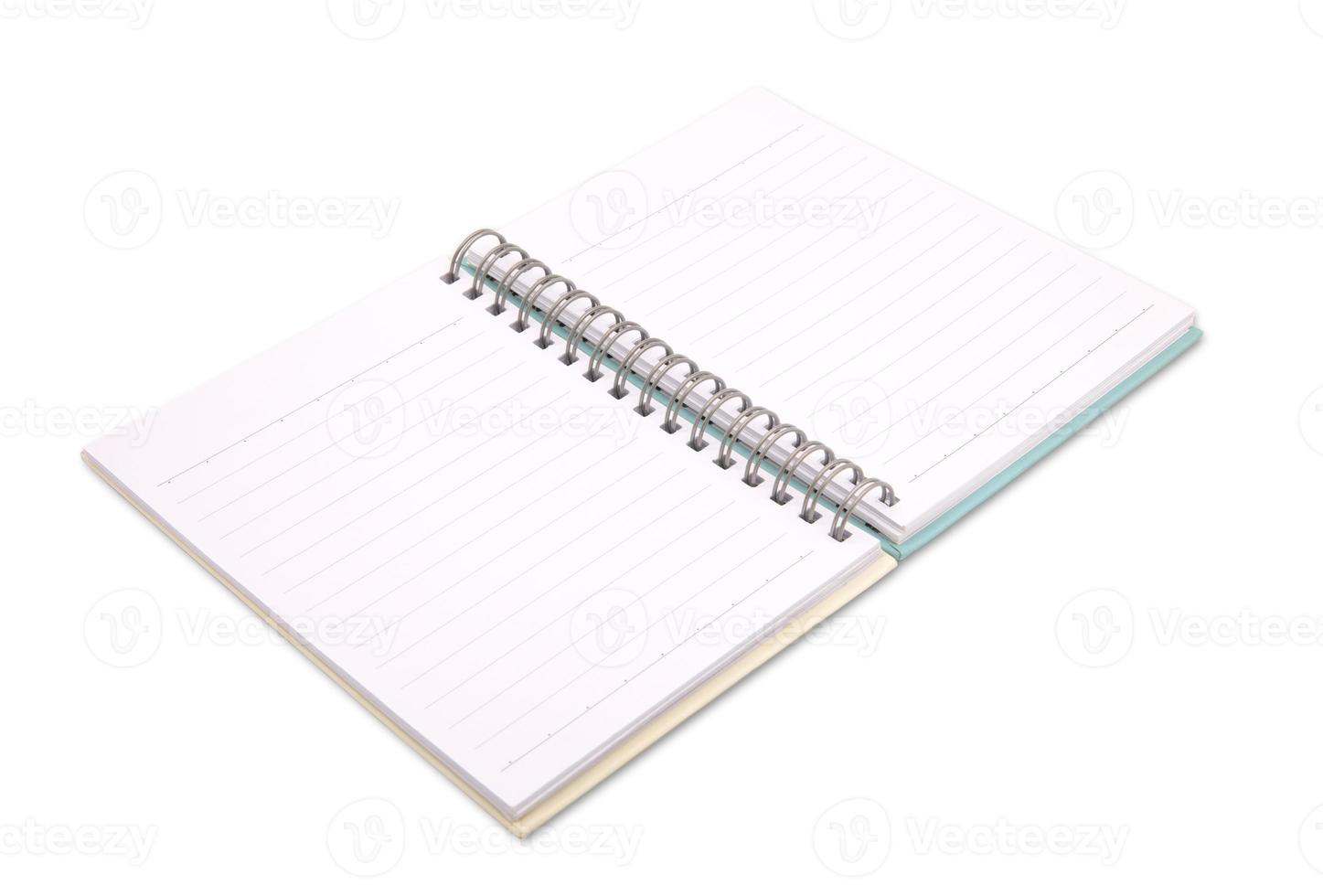 Opened spiral notebook isolated on white background photo