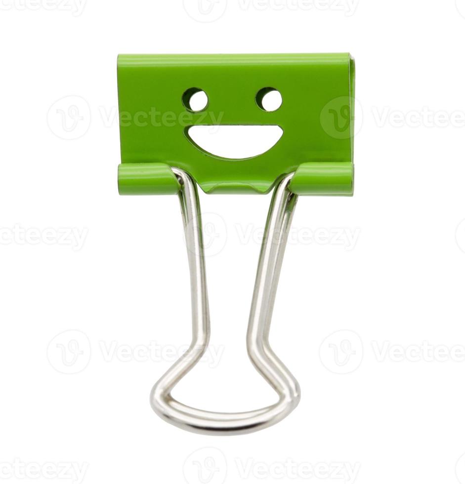 Smile green binder clip isolated on white background photo