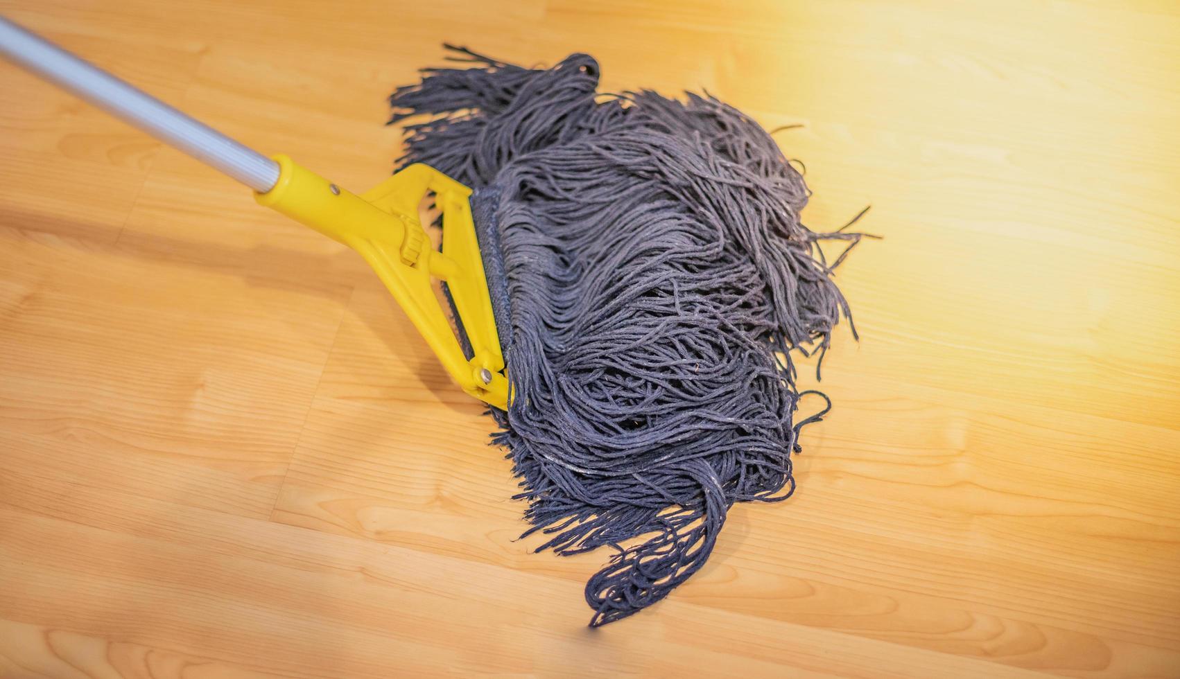 The dirty mop cleaning on the wood floor. 8345258 Stock Photo at Vecteezy
