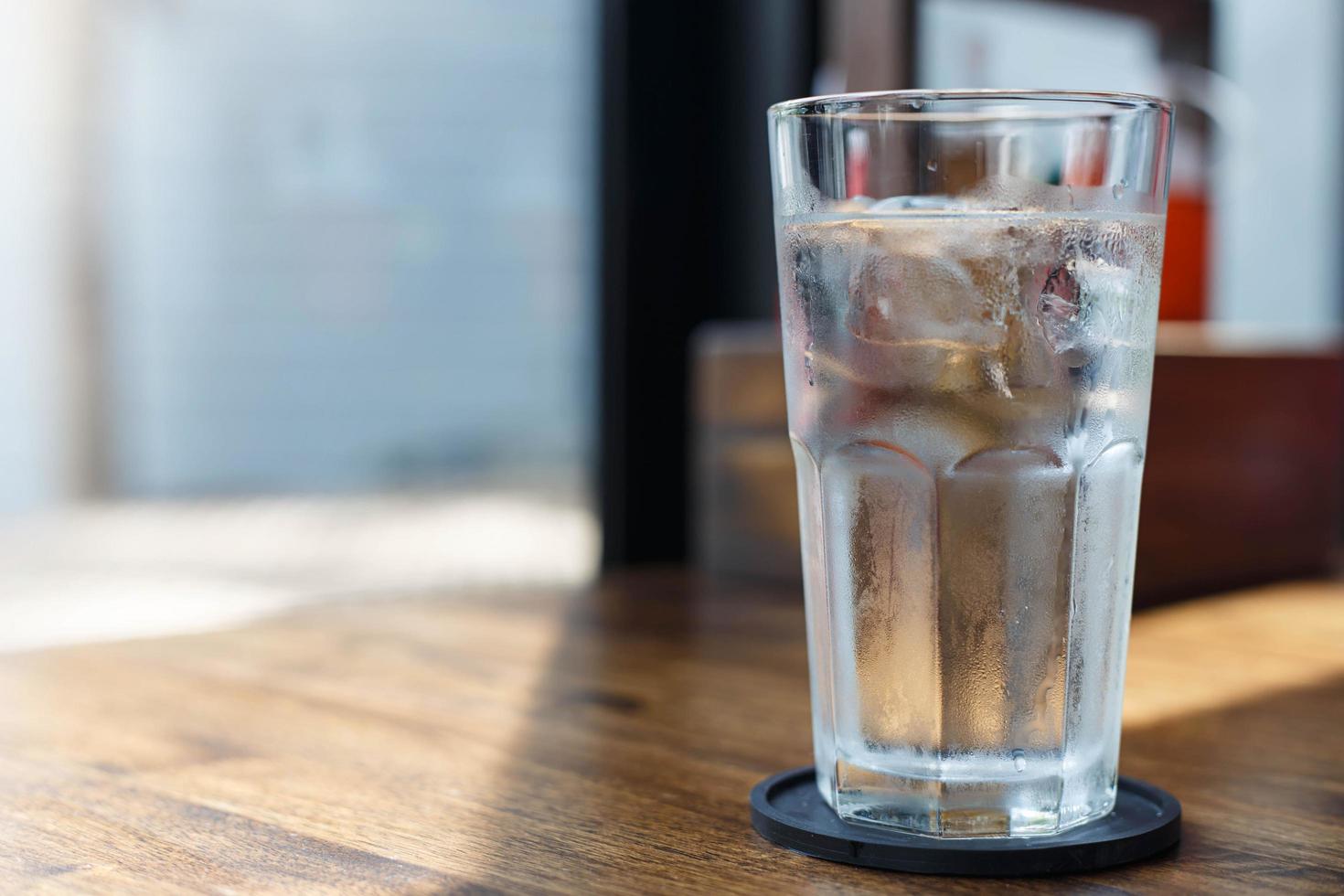 Glass of cold drinking water photo