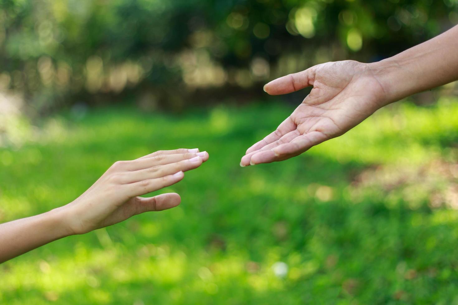 A man giving helping hand to another photo