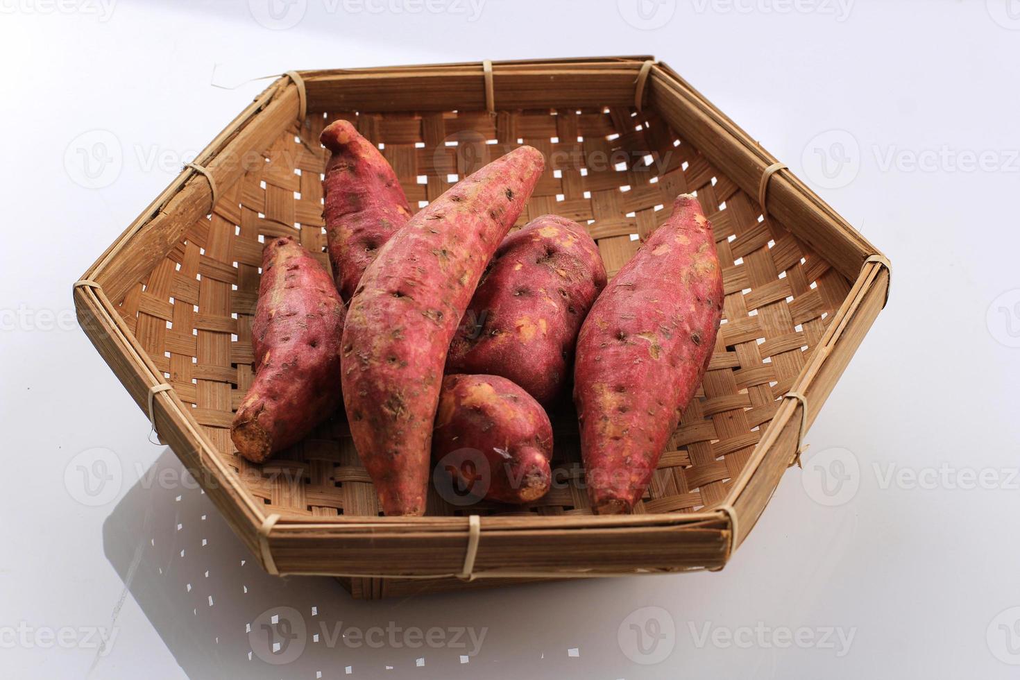 Baby Mini Red Sweet Potato Ubi Merah Isolated on White Background. Copy Space for Text photo