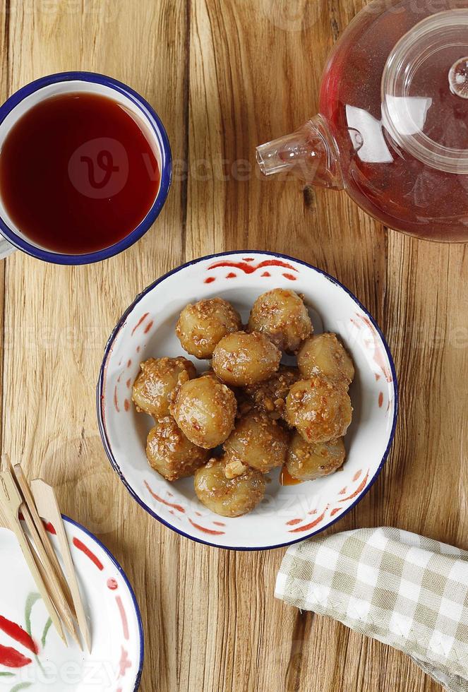 Cilok is Aci Dicolok, Traditional Street Food from West Java, Made from Tapioca or Aci Flour. Cilok is a Round Shaped Snack with a Chewy Texture photo