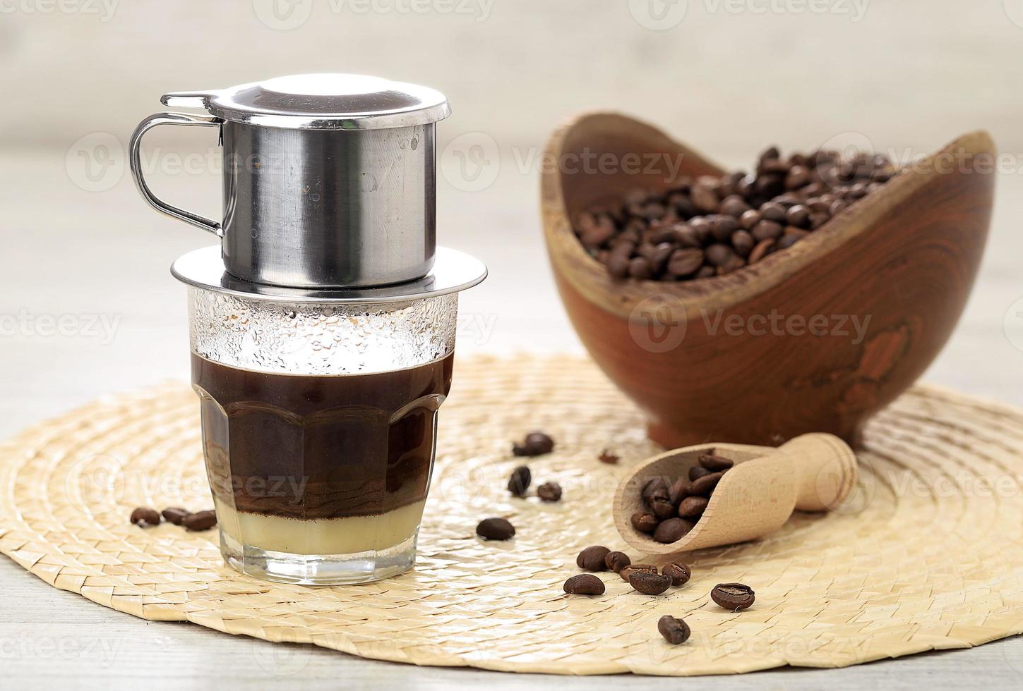 Vietnamese coffee in glass cups, traditional metal coffee maker phin. Black drip  coffee as famous in Vietnam 25499474 Stock Photo at Vecteezy