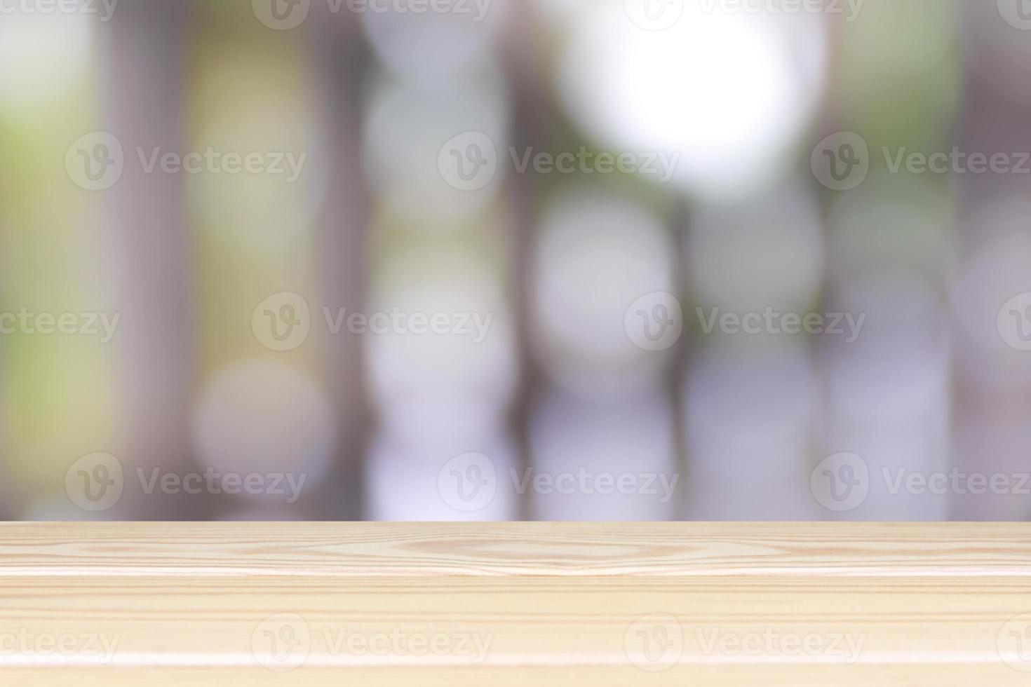 Empty wooden table with light bokeh in garden space background montage style, For place the product. photo